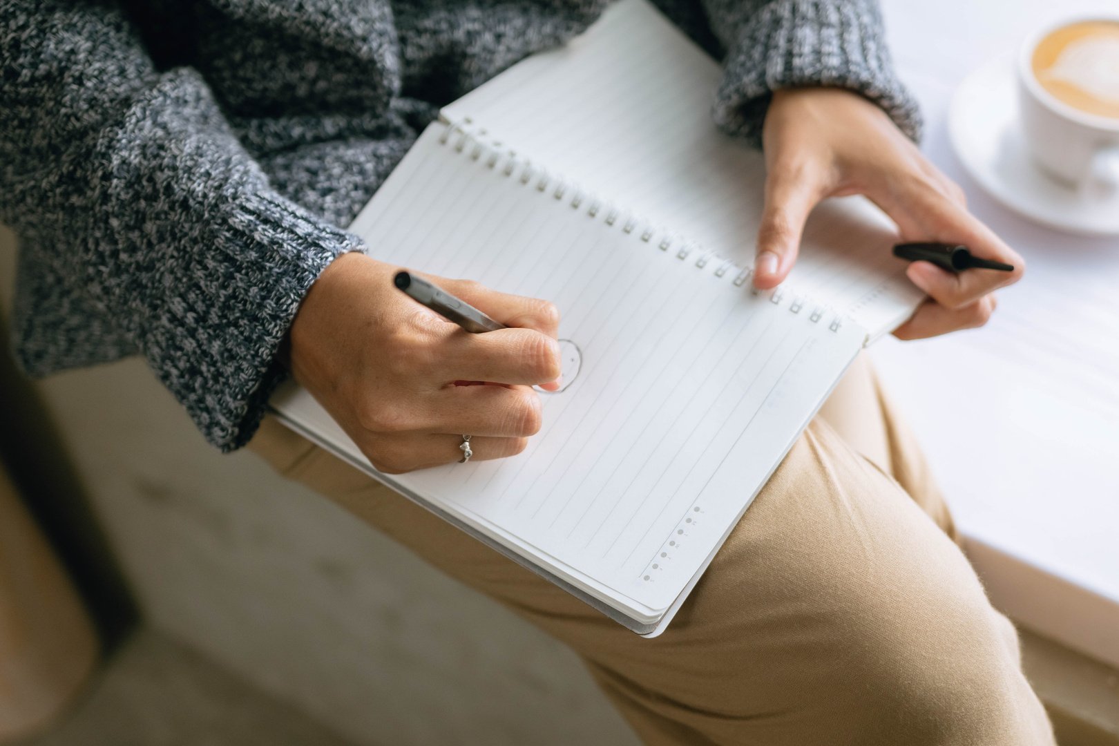 Woman Drawing on Notebook